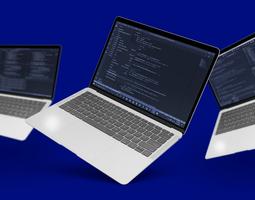 Three laptops with code