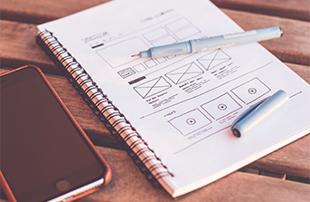 Web design drawing in notebook