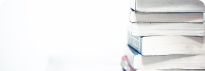 Six books stacked on top of one another